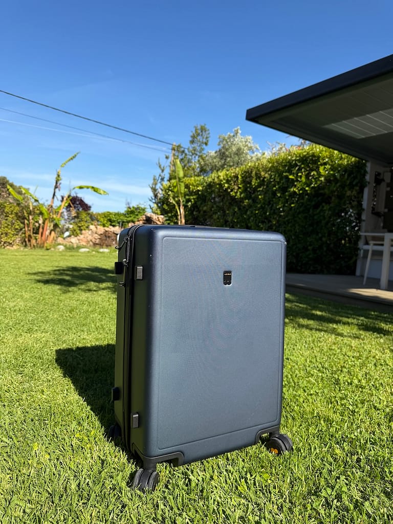 Level8 suitcase looking pretty great, even outside in grass, dirt, and the sun