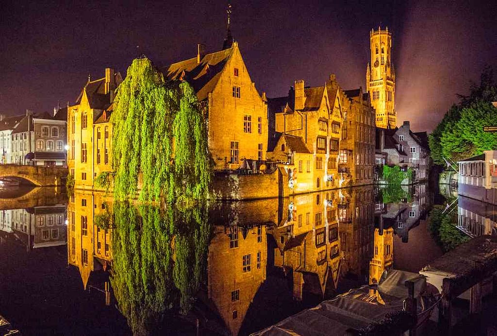 Reflection of a historic building in Bruges, Belgium, in the canal.