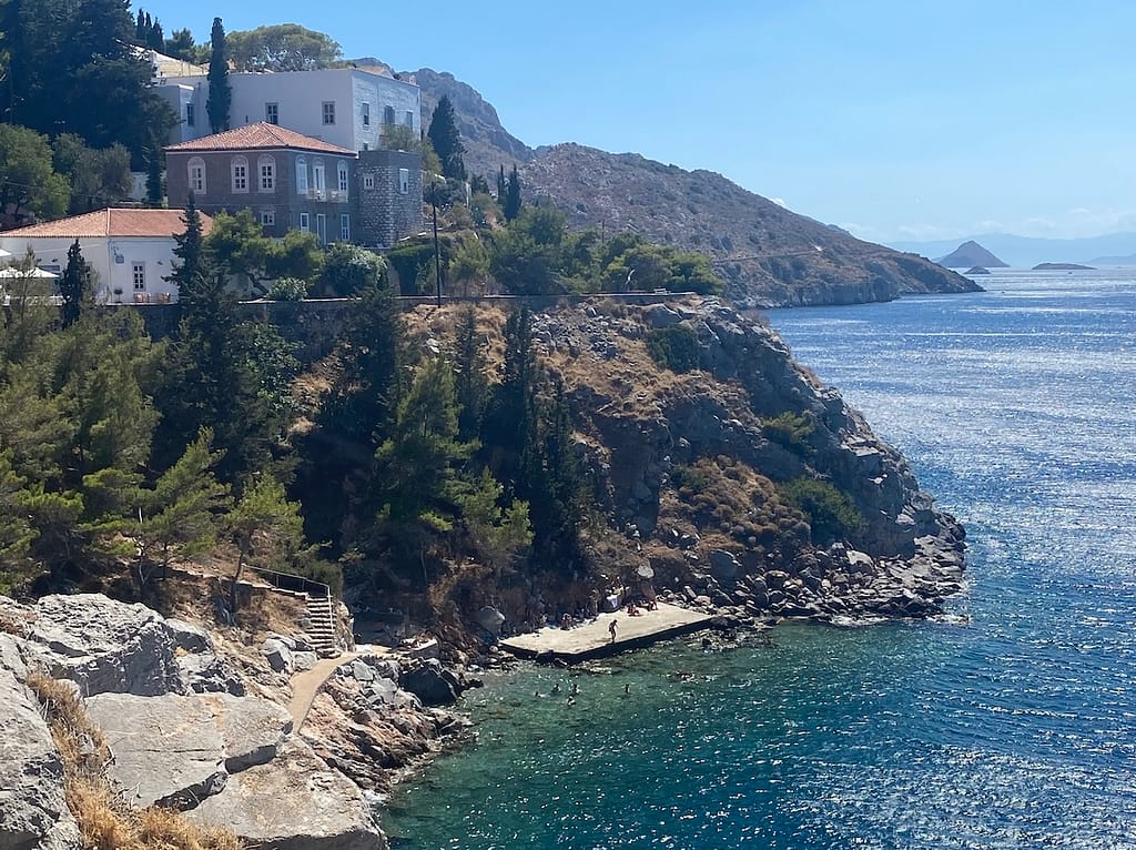 You can visit towns outside the main port of Hydra, like nearby Kamini