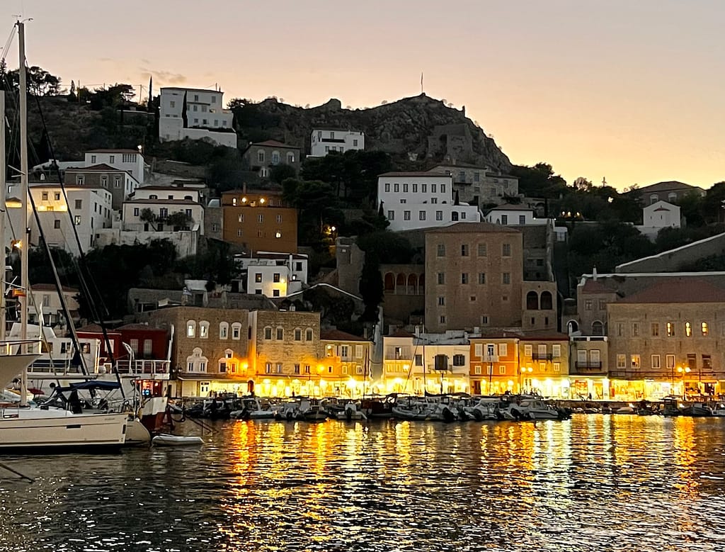 Hydra's portside shops all lit up at night
