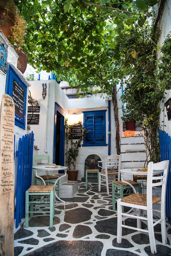 White and blue decorated cafe in Ano Syros.
