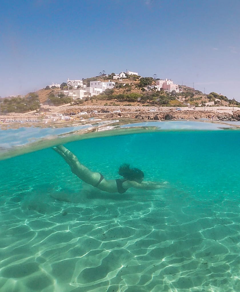 Swimming at Agathopes Beach in Syros, Greece.
