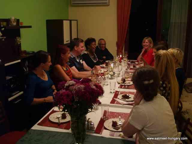 Laughs around table - one of the best part of eating with locals is sharing our experiences traveling.