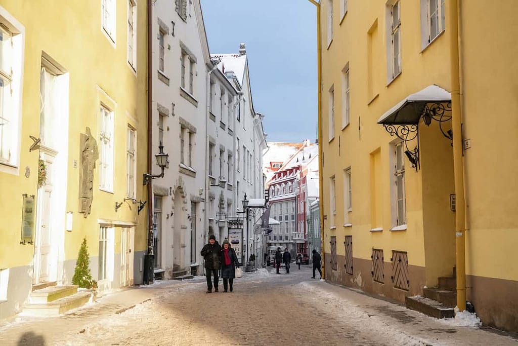 Sun hits the streets of Tallinn in the few hours of sunshine the city gets in the winter. The sunlight brings out the vibrant colors of the buildings lining the passage.