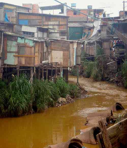 Polluted water running through the favela, one of the many issues affecting the community.