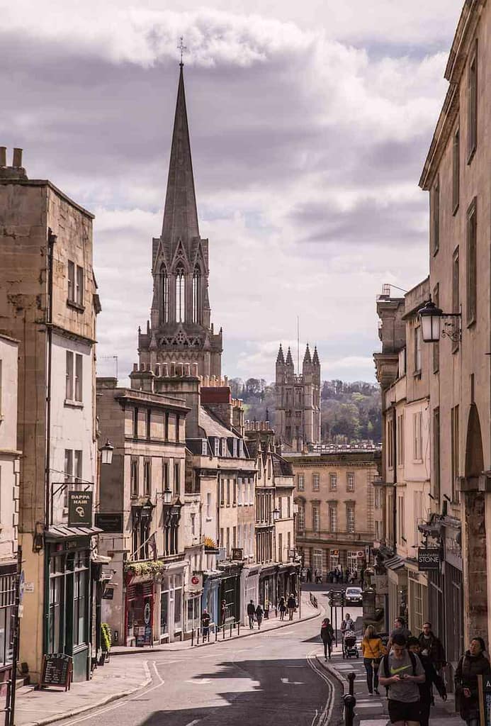 The view of Bath at sunset, with the sky tinged purple among the historic buildings.